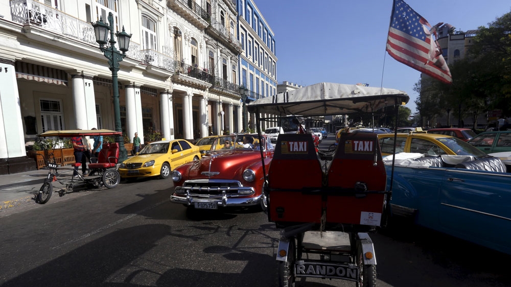 TRICYCLE IN HAVANA WITH THE US FLAG