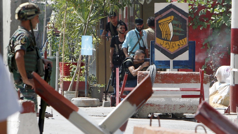 Lebanese soldier mans checkpoint at entrance to Ain al-Hilweh Palestinian refugee camp, as Palestinian Fatah gunmen fire at Jund al-Sham militants near Sidon