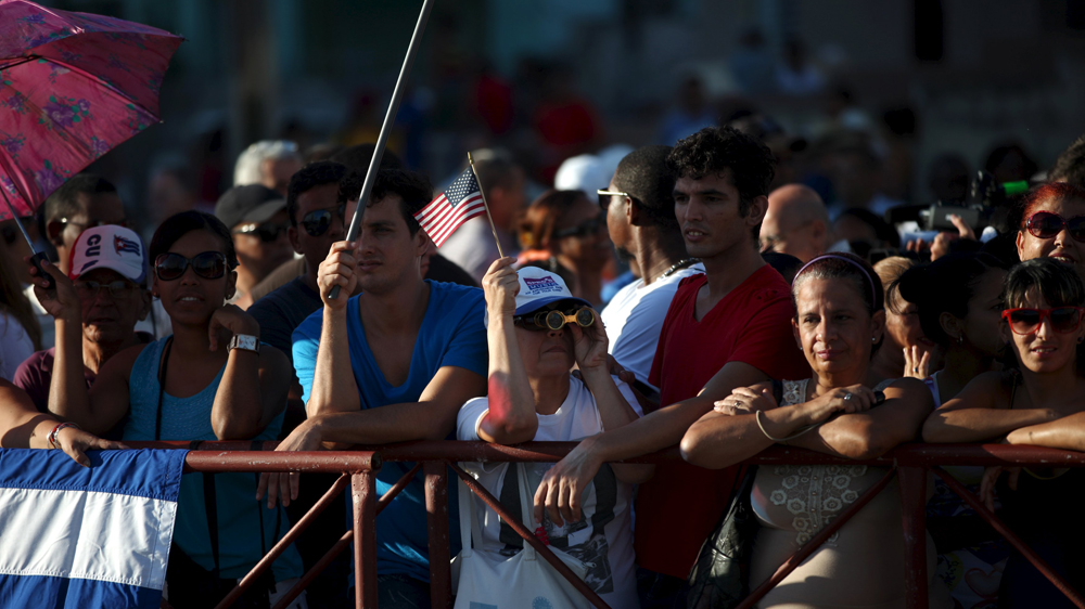 Cubans waited near the embassy to witness the flag-rising [Reuters]