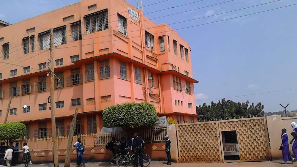 
Once a major high school, Kololo High was evicted and now its students study in a smaller, rented building [Nangayi Guyson/Al Jazeera]
