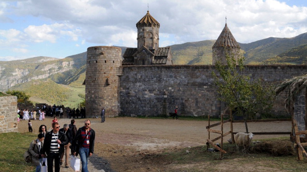 Tourists visit the ancient Tatev monastery in Armenia''s southern mountains close to the border with Iran [AFP]