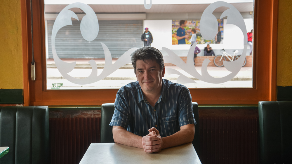 Laurent Roussel, president of the Merchants' Union and a member of the Calais City Council said the city has suffered financially because of migrants [Ben Gerdziunas/Al Jazeera]