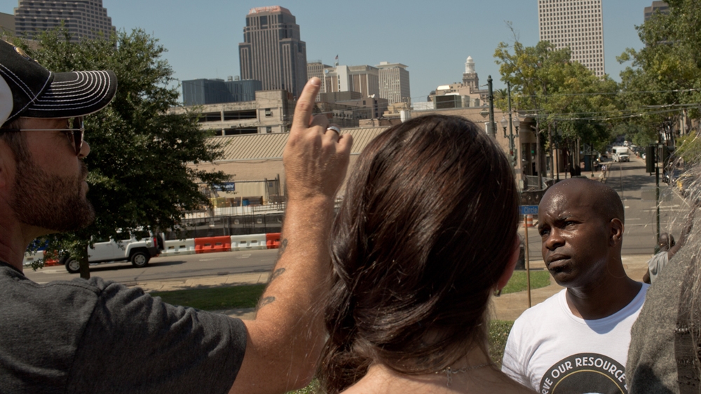 Tilman Hardy, whose ancestor was a Buffalo Soldier, was one of two black people speaking to the protesters. 'I hope you understand that this particular symbol was put up when people who look like me didn't have a choice in the matter,' he said. One protester asked him whether he still honours his own ancestors, despite the atrocities committed by Buffalo Soldiers against Native Americans [Roopa Gogineni]