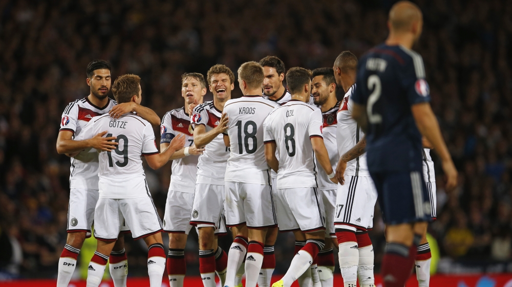 Thomas Muller celebrates with team mates after scoring the second goal for Germany