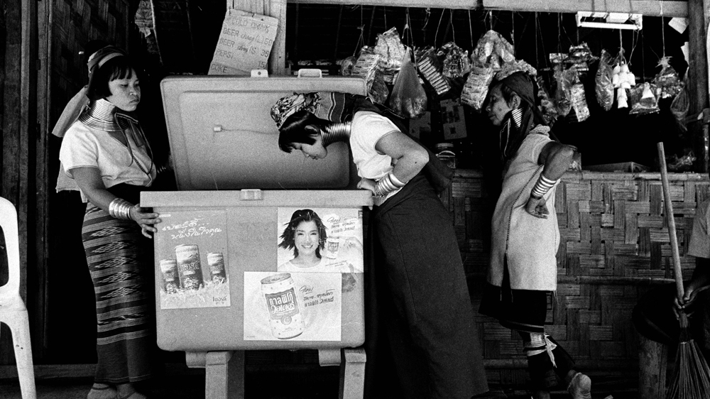 Padaung women shopping at their local store in the village of Nai Soi [Jack Picone] 