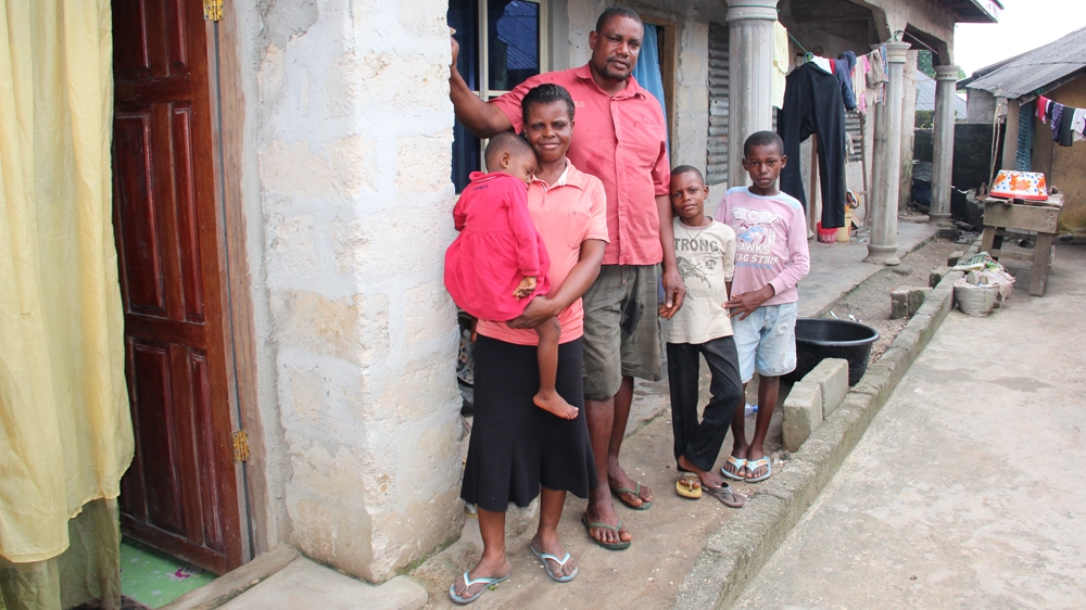 With the compensation they received from Shell, John Gbara and his wife have been able to build a three-bedroom house for their family [Femke van Zeijl/Al Jazeera]