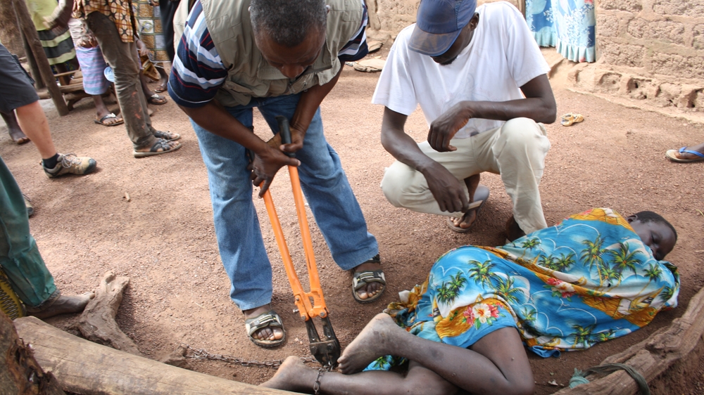 During her journey, Victoria met Amenan - when she met her she was sleeping on the ground, and her right ankle was tied to a tree [Victoria Baux/Al Jazeera] 