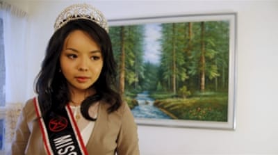 Miss World Canada Anastasia Lin poses with her crown before an interview at her home in Toronto, Ontario [REUTERS]