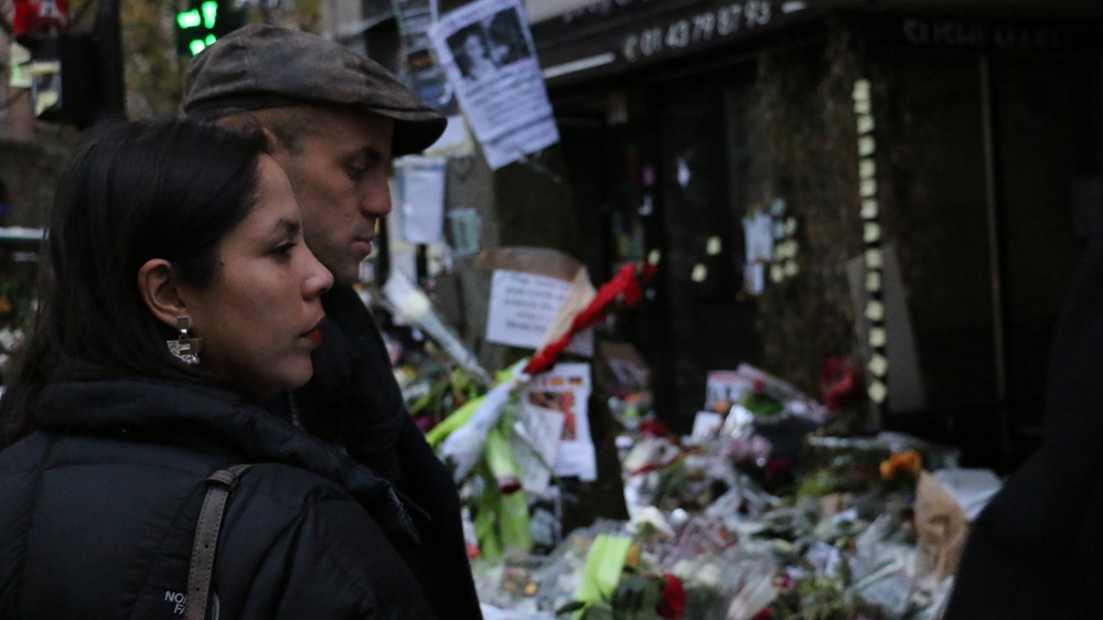 Esther and the writer outside La Belle Equipe [Mounia Gacem M'Henni/Al Jazeera] 