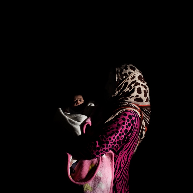 Twenty-eight-year-old Ghazzieh is from Idlib and has been in Lebanon for four months. She has seven children. Her youngest, Sham, is 40 days old. Sham had to stay in an incubator for five days. So far, they have only been able to pay for half of the hospital expenses. The hospital has retained her ID until she pays the remainder [Felipe Jacome/Al Jazeera]  