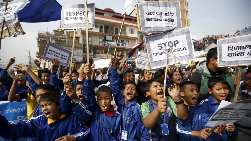 Nepalese students holding placards take part in a protest to show solidarity against the border blockade in Kathmandu