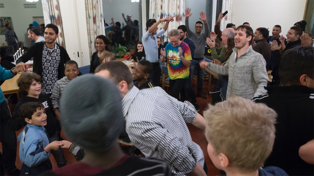 After dinner, the tables and chairs were moved to make room for dancing. Some required a little extra encouragement, but everyone eventually joined in [Paulina/Al Jazeera]