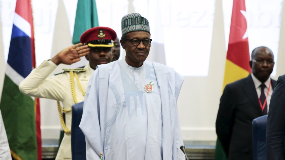 Nigeria''s President Muhammadu Buhari stands at the opening of the 48th ordinary session of ECOWAS Authority of Head of States and Government in Abuja