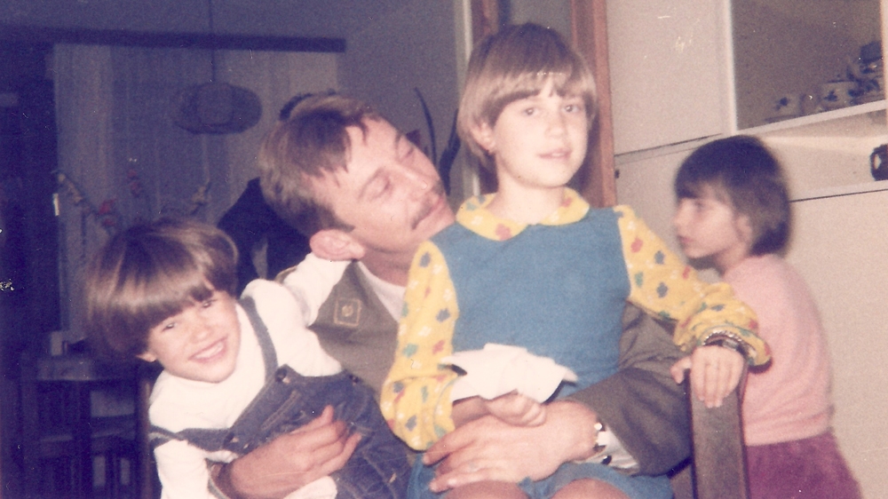 Tina and her sister with her father after he returned from Kosovo; after this photo the girls and their mother lost track of him [Tina Smalcelj/Al Jazeera]