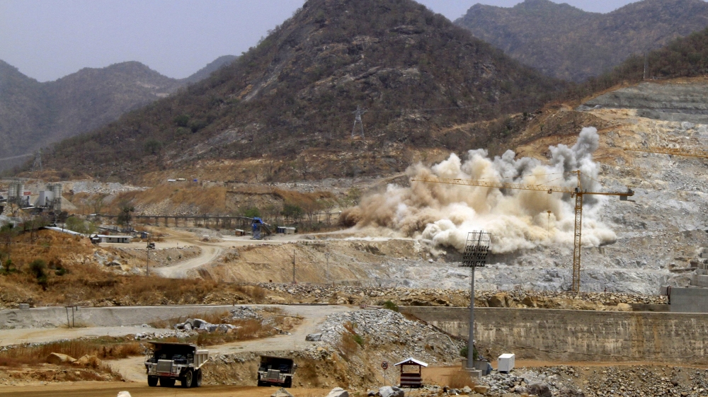 A cloud of dust rises from a dynamite blast, as part of construction work, at Ethiopia