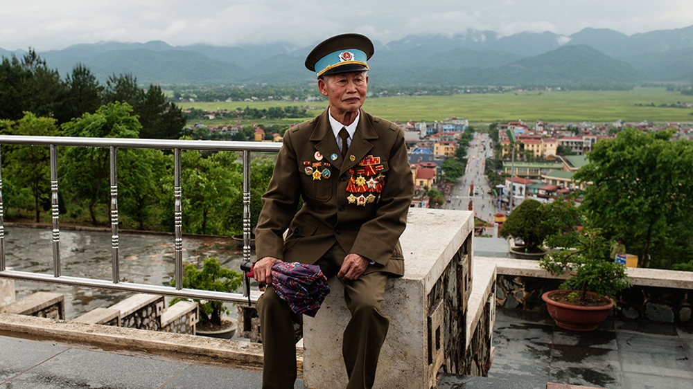 Pham Dinh Cu, 85, recalls having to move artillery and weapons across difficult mountainous terrain during the Battle of Dien Bien Phu [Vincenzo Floramo/Al Jazeera] 