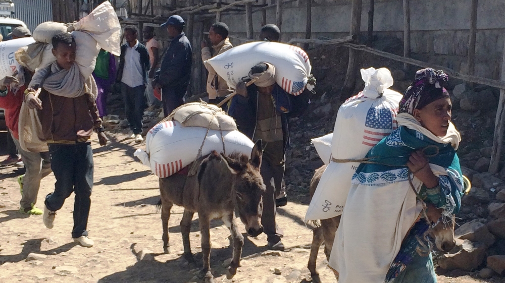 Families begin their journey home from the Estayesh Food Distribution Site in Denkena Kebele, Meket Woreda, Ethiopia [AP]