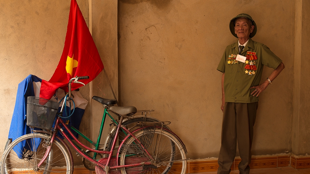 Nguyen Xuan Dung, 84, fought with the 174 Anti-Aircraft Battalion during the Battle of Dien Bien Phu [Vincenzo Floramo/Al Jazeera] 
