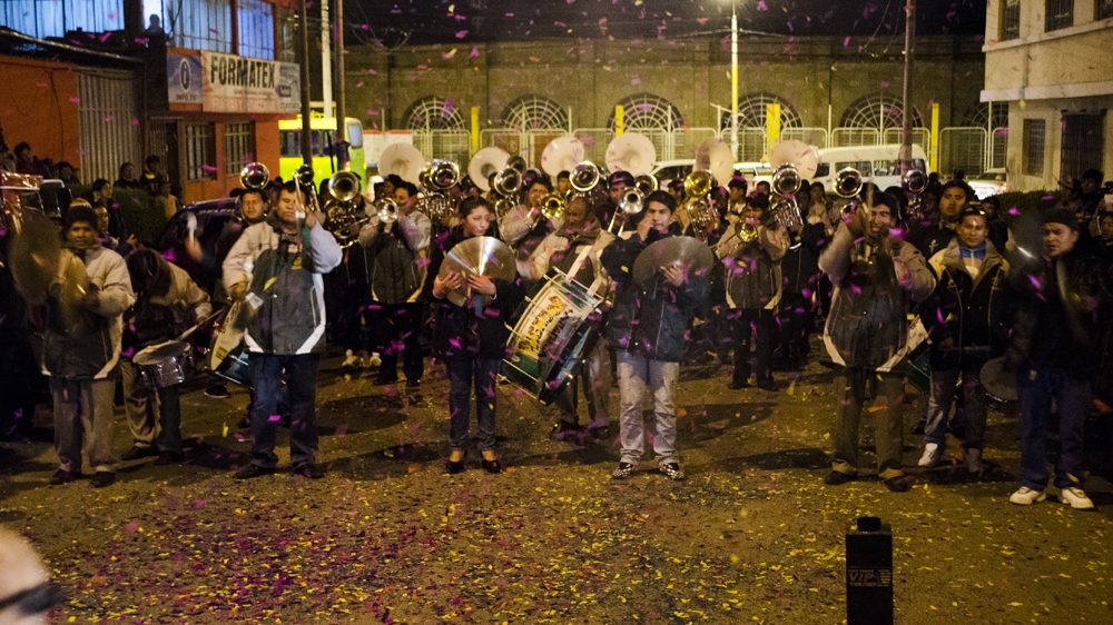 During the welcoming of the bands, the ensembles are received with parties and fireworks  [Carlos Tello/Al Jazeera]  