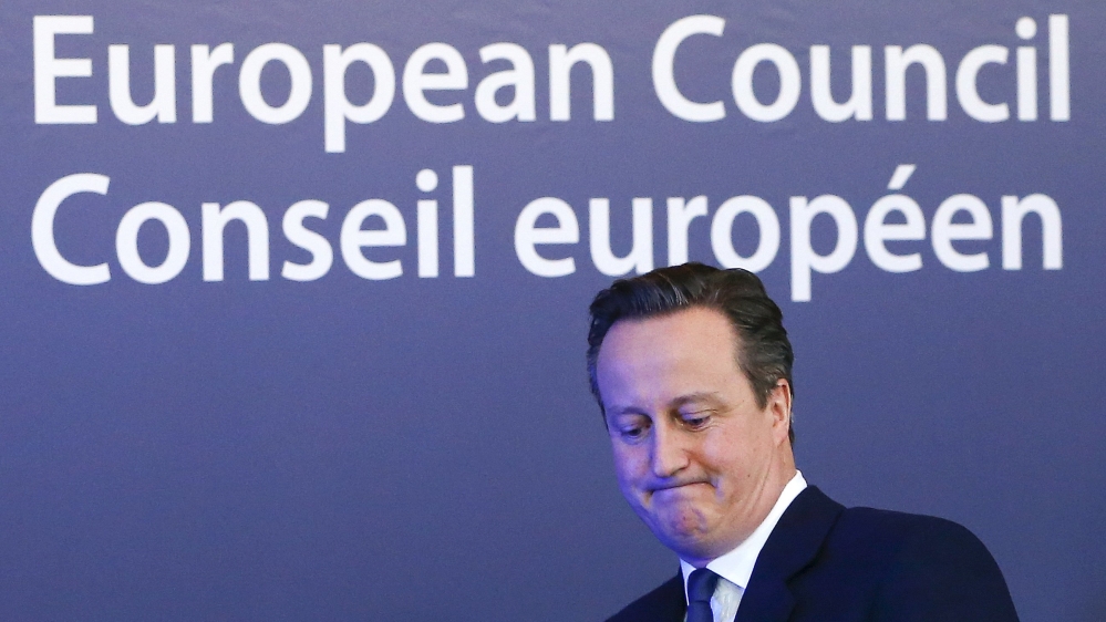 British Prime Minister David Cameron waves as he leaves a European Union leaders'' summit in Brussels [REUTERS]