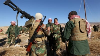 Kurdish peshmerga forces gather in the town of Sinjar, Iraq last November [REUTERS]