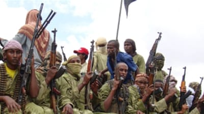 Al-Shabab fighters sit on a truck as they patrol in Mogadishu, Somalia.