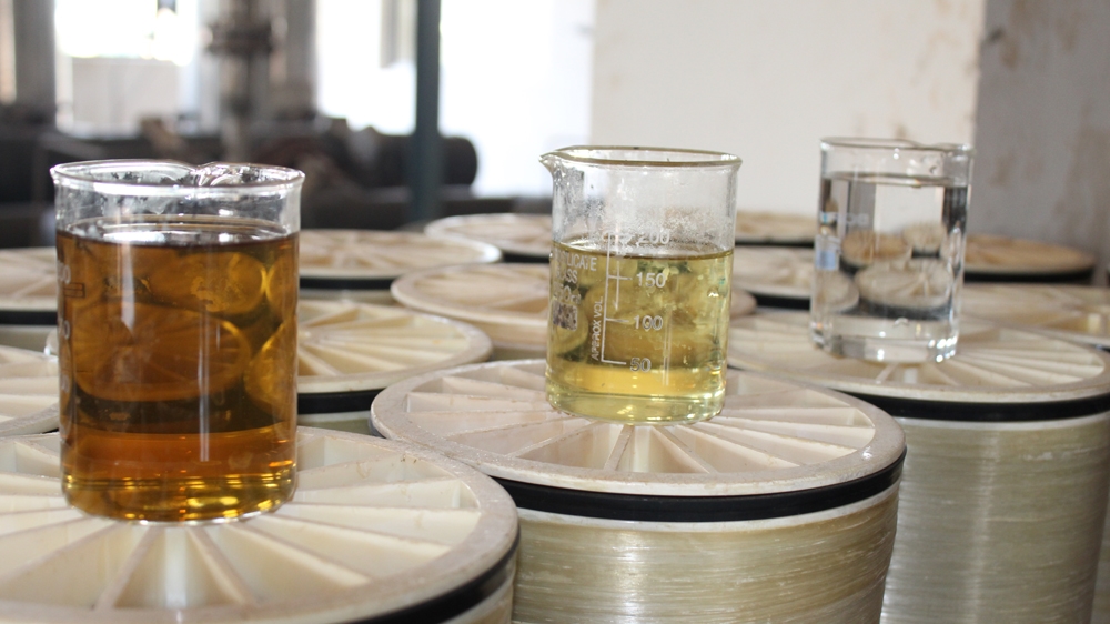 What the effluent water looks like after every stage of treatment, with progressively more impurities being removed with each step [Sandhya Ravishankar/Al Jazeera]