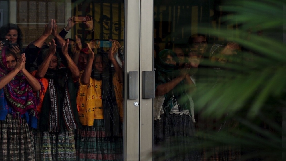 The women acknowledge their supporters after the verdict [REUTERS/Josue Decavele]