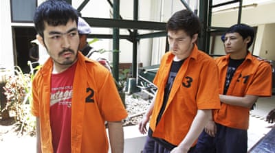 Uighur men arrested in September while trying to meet Indonesia's most wanted man, Abu Wardah Santoso, in Central Sulawesi [AP]