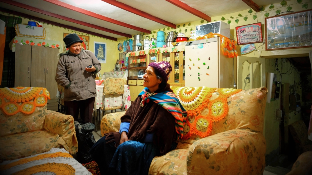 Dolly Quillka and Romalda Golque say saving any extra income from their work is very difficult [Eline van Nes/Al Jazeera]