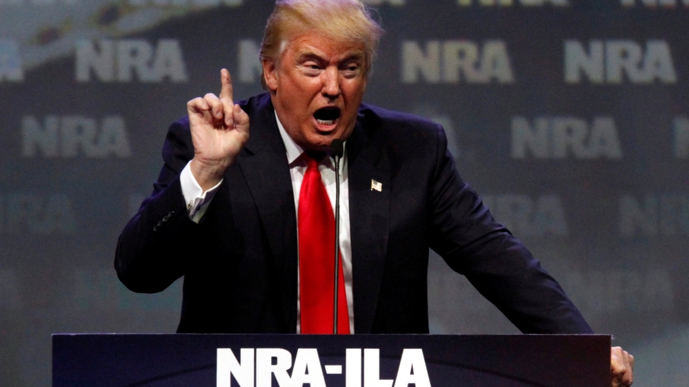 Republican presidential candidate Donald Trump addresses members of the National Rifle Association during their NRA-ILA Leadership Forum during at their annual meeting in Louisville