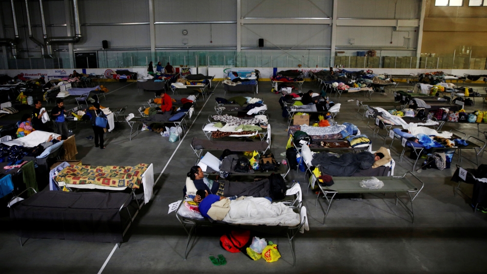 Evacuees from the Fort McMurray wildfires use a hockey rink full off beds as they sleep and rest at the