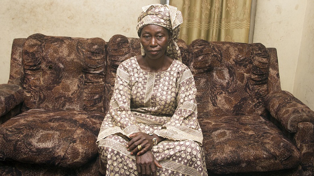 Mama Debo sits in the parlour of her family home [Hamed Adedeji/Al Jazeera]