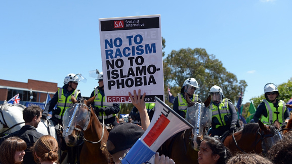Members of the Campaign Against Racism and Fascism hold a rally in Melbourne, Australia in 2015 [Getty]