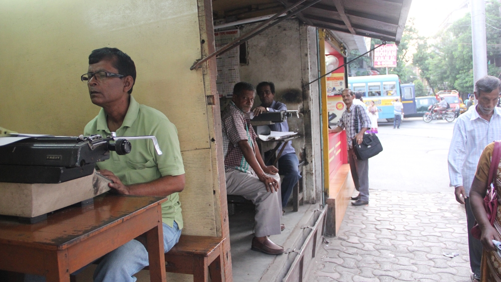 A lane of typists [Swati Sanyal Tarafdar/Al Jazeera] 