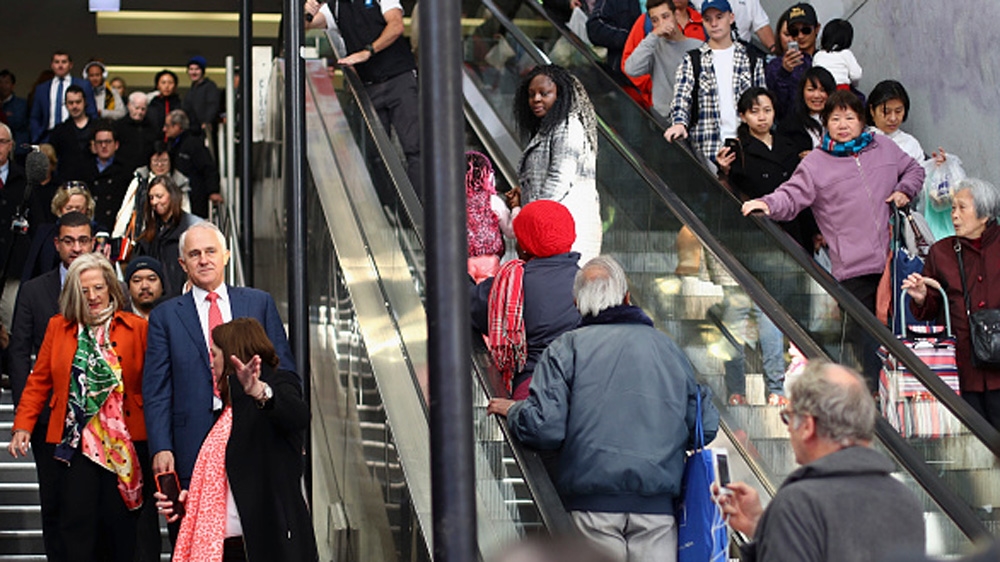 Prime Minister Malcolm Turnbull and his wife arrive at Hurstville Station as he campaigns in Sydney, Australia [Getty]