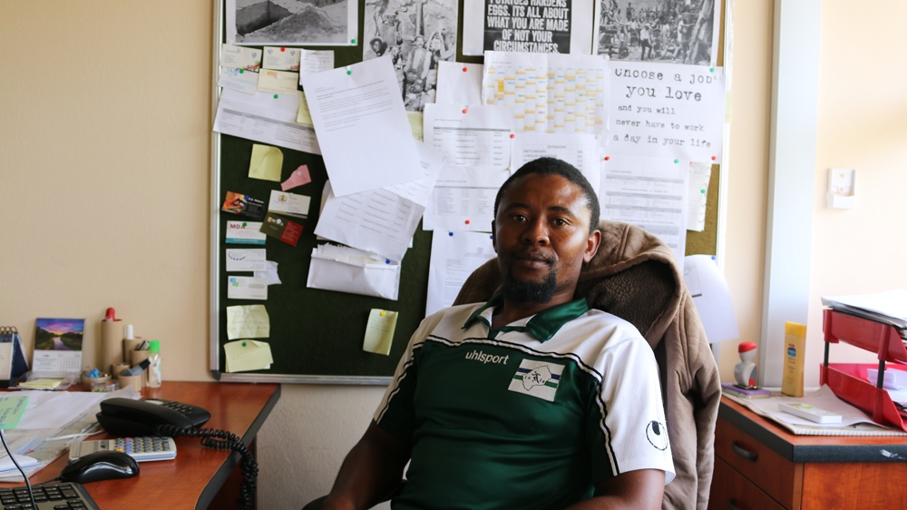 Shafiq Isaacs helps ex-miners or their families who may be owed compensation by the mining companies for occupational lung disease [Caelainn Hogan/ Al Jazeera] 