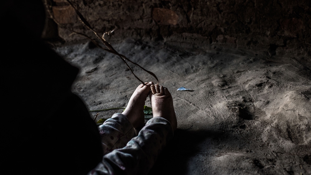 Sekiringa plays in one of the huts. He is only three, and it's hard to keep him entertained inside, out of the sun, but he stays there for a few hours a day for his own saftey [Fredrik Lerneryd/Al Jazeera]
