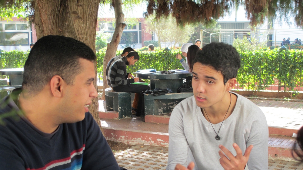 According to Mohammed Ait El Maati, right, there are four students from African countries in his geology department and some have never spoken a word in French [Soukaina El Ouaai/Al Jazeera]