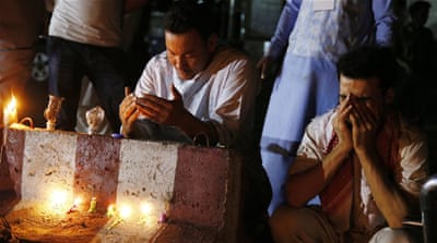 Afghans pray for the victims of a suicide bomb blast during a memorial in Kabul, July 23 [EPA]