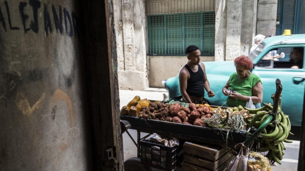 Jose makes a sale [El Estornudo/Al Jazeera] 