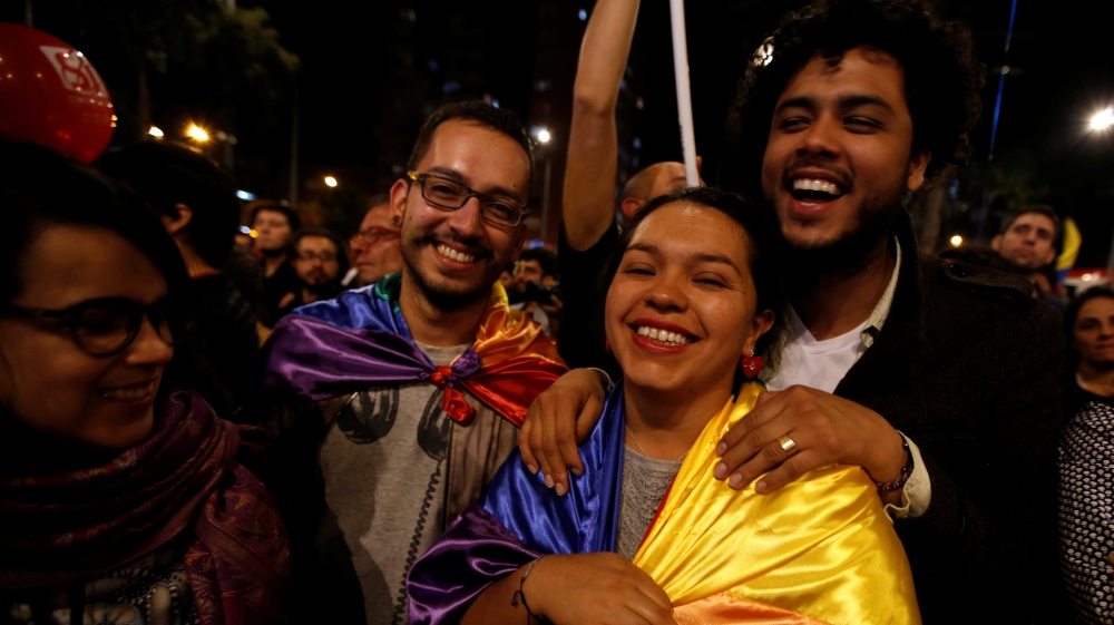 People celebrate after Colombia''s government and Revolutionary Armed Forces of Colombia (FARC) rebels reached a final peace deal on Wednesday to end a five-decade war, in Bogota, Colombia