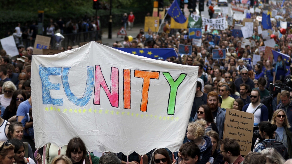 People hold banners during a demonstration against Britain''s decision to leave the European Union, in central London