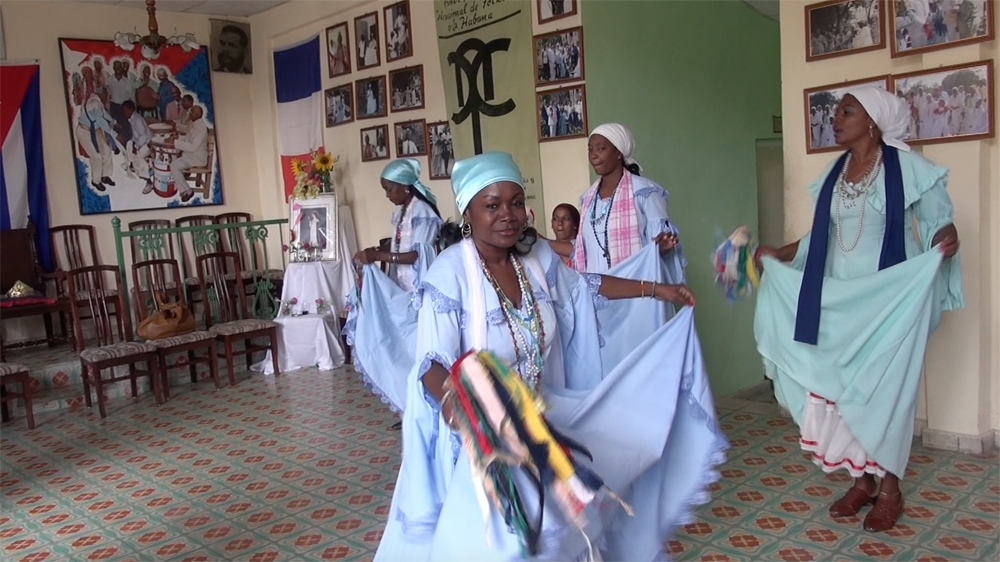  The costumes of the Cuban dance known as tumba frances  evoke the elegant ballgowns of bygone Haiti [Sylvia Hines/Al Jazeera]