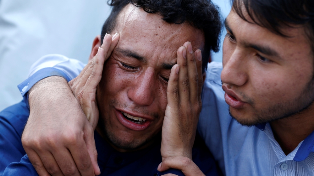 An Afghan man weeps outside a hospital after a suicide attack in Kabul, Afghanistan, July 23, 2016 [Mohammad Ismail/Reuters]
