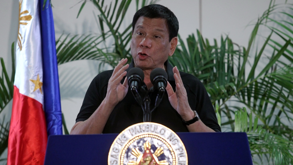 Philippines President Rodrigo Duterte gestures during a news conference upon his arrival from Vietnam trip at the International Airport in Davao city