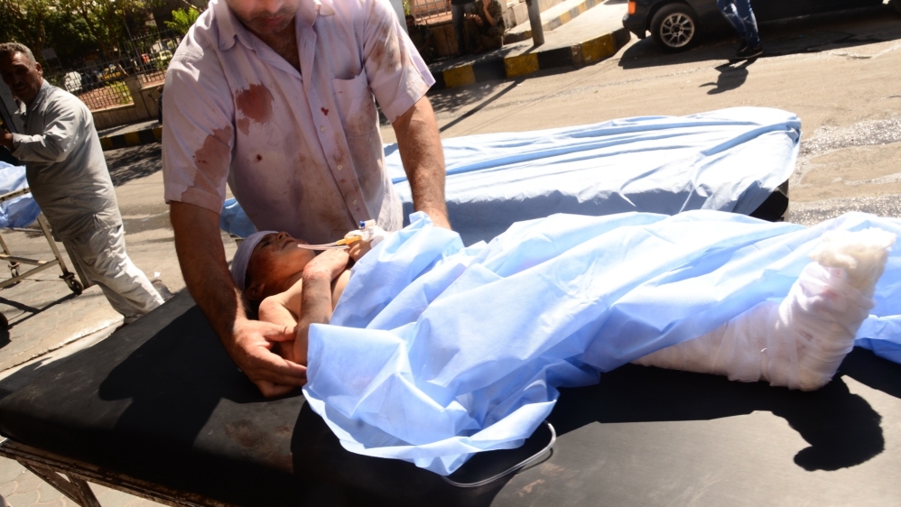A wounded Syrian child is rushed into a hospital after she was hit by mortar shells that targeted Aleppo