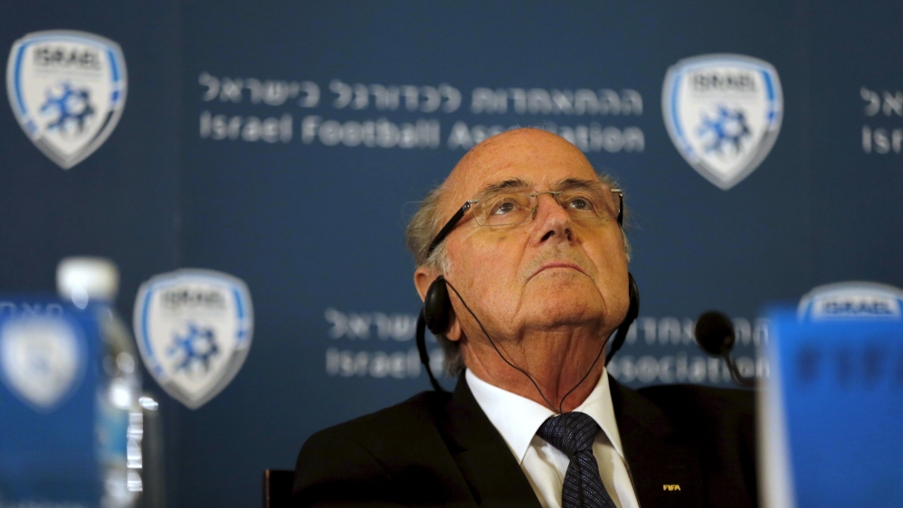 FIFA presidentSepp Blatter wears headphones during a news conference in Jerusalem