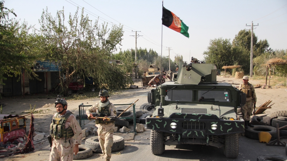 Afghan security officials patrol in Aachin district of Kunduz, Afghanistan [EPA]n