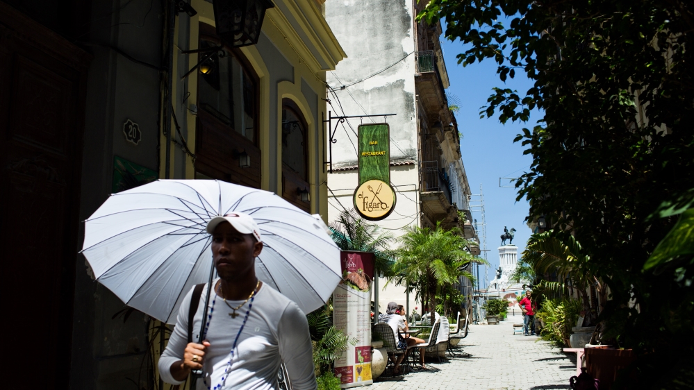 A man walks by the Callejon de los Peluqueros (